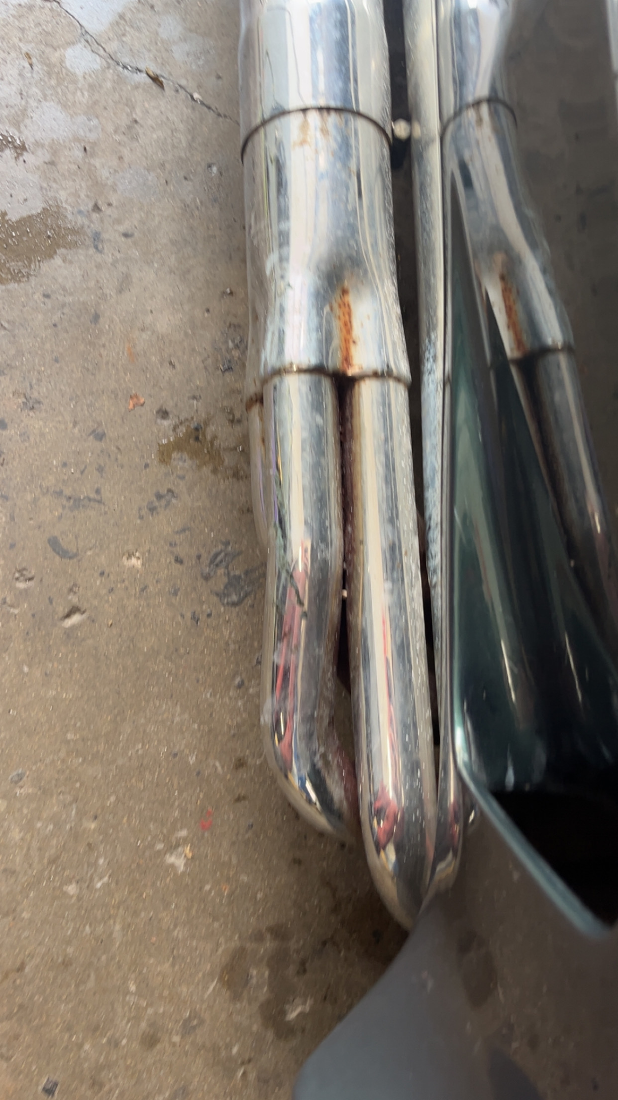 Rusty exhaust tip before polishing