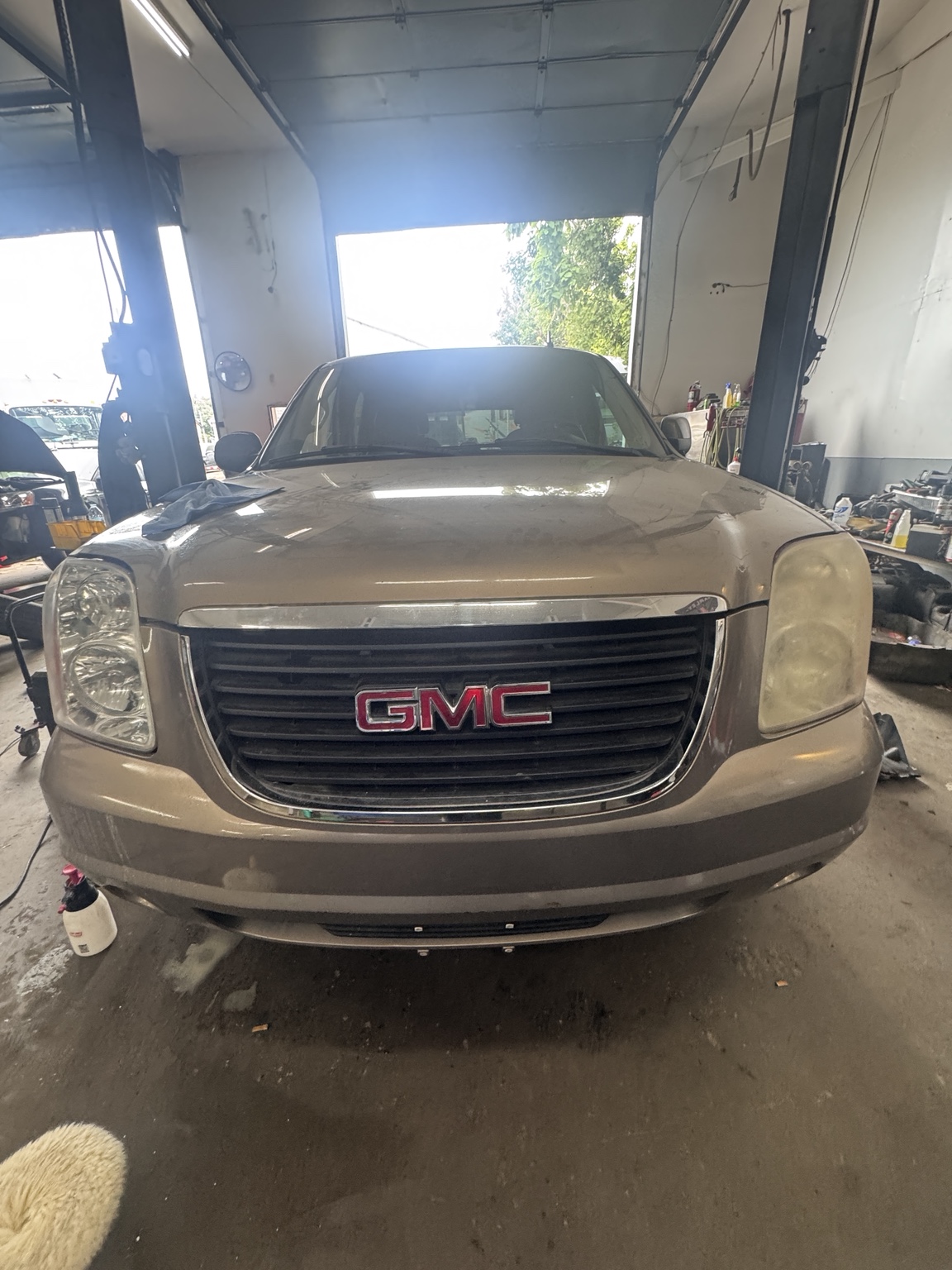 Cloudy GMC headlight before restoration